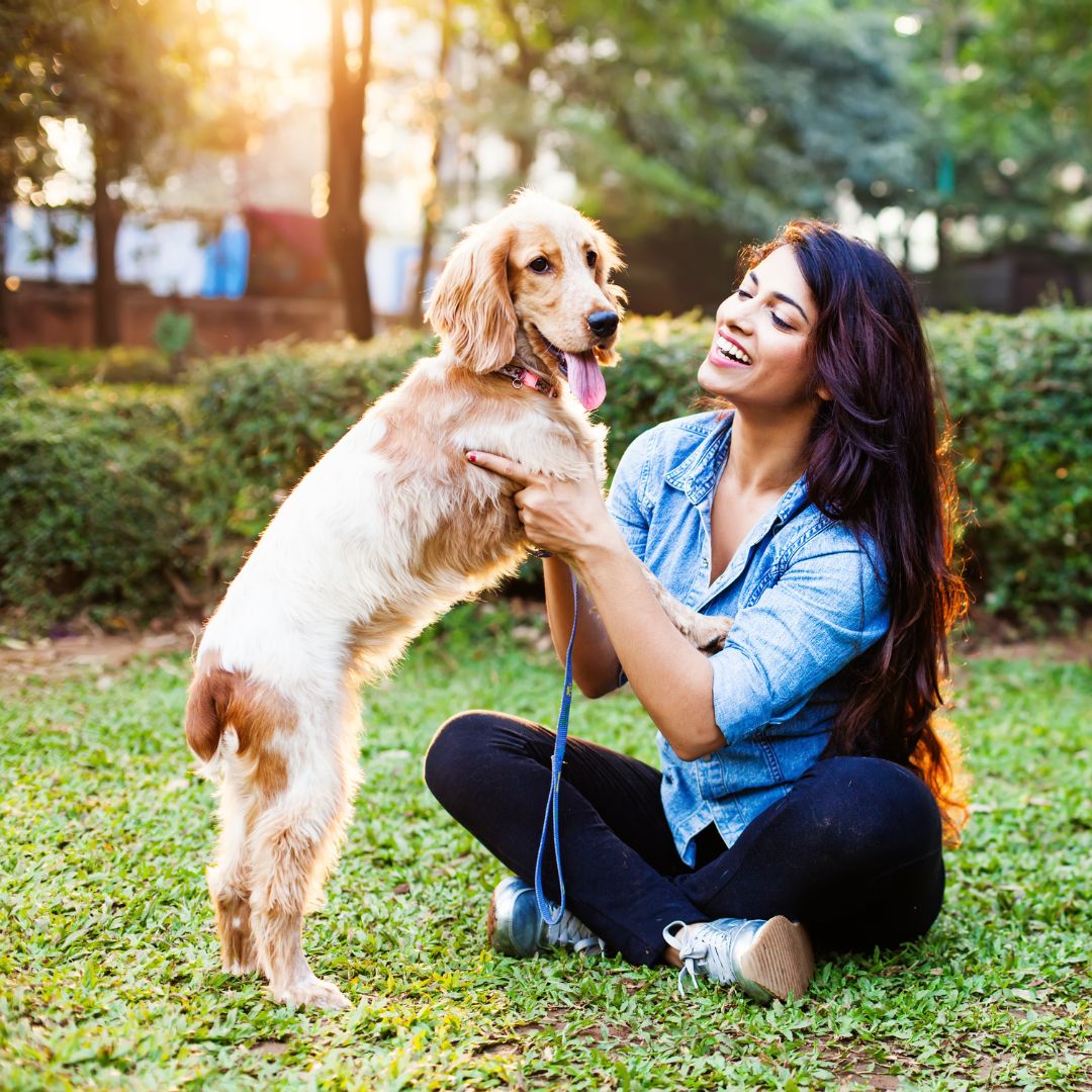 woman spending time with dog