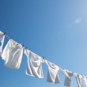 white clothes hanging in the sun