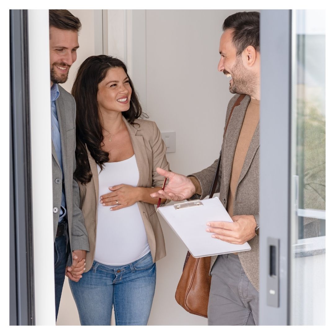 a couple walking through an apartment