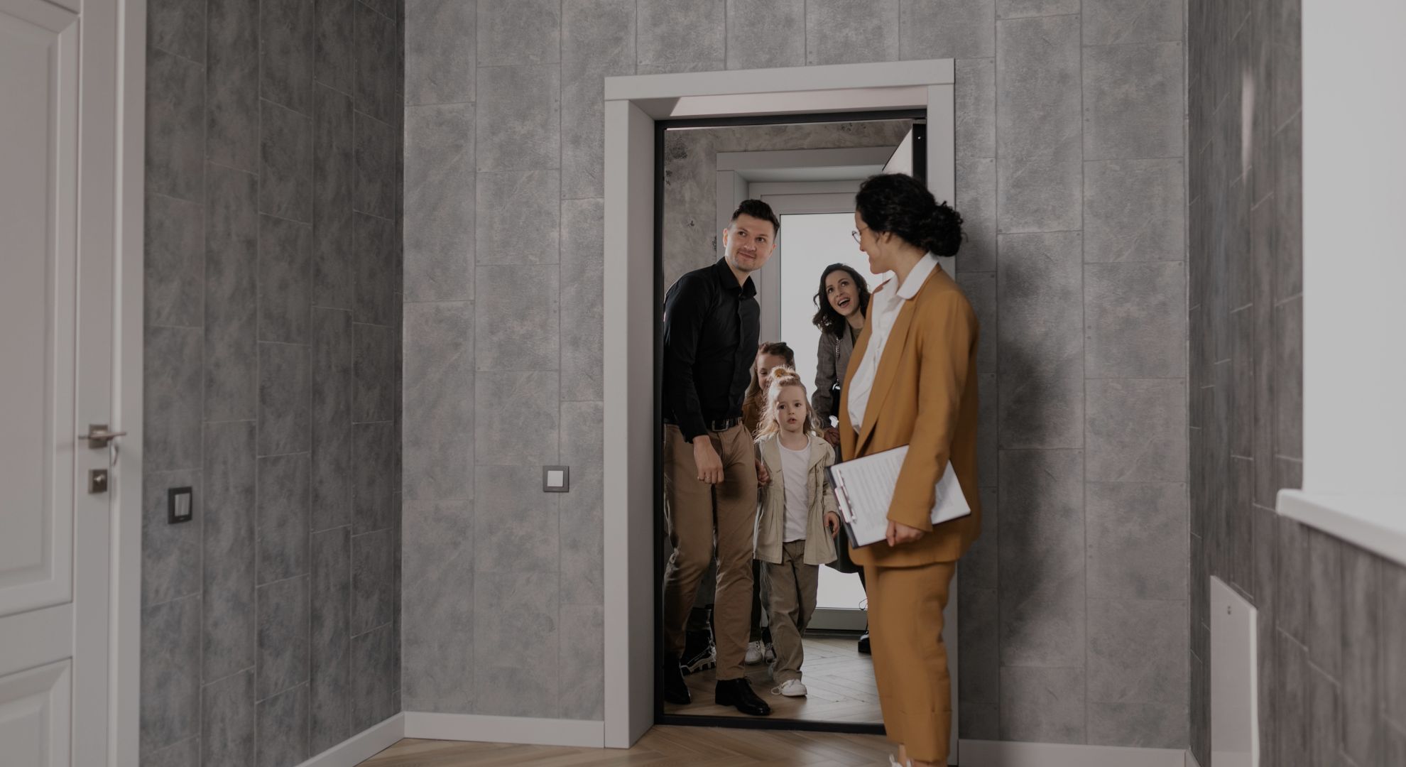 a family going through an apartment on a tour