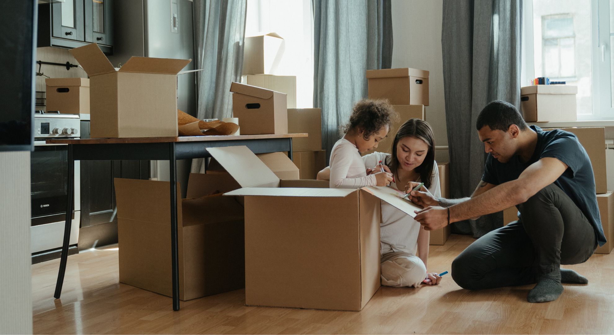 couple unpacking boxes
