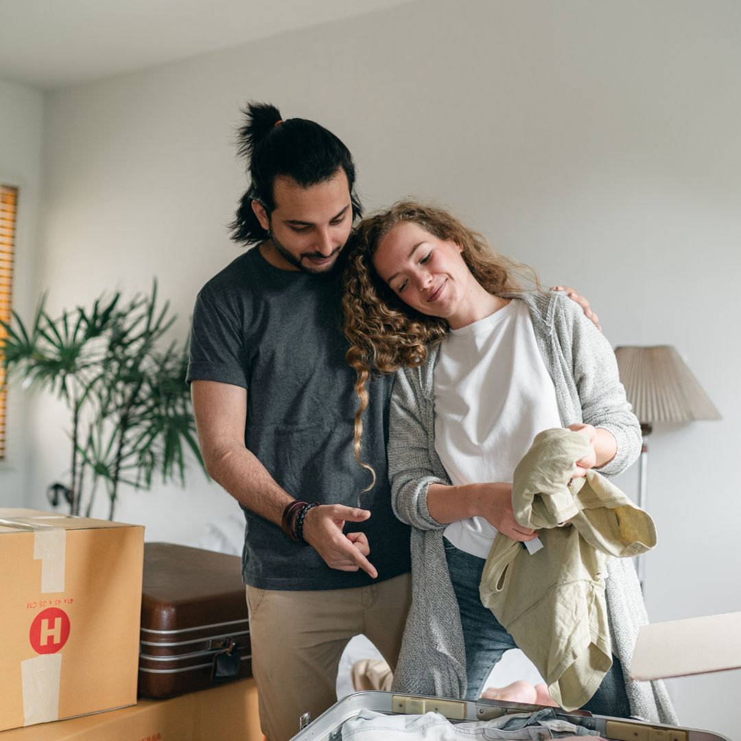 couple unpacking cloths